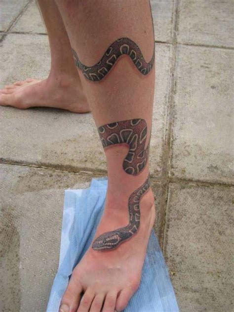 snake wrapped around leg tattoo|Snake tattoos around leg